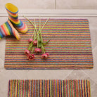 Candy Bright Doormat - a 100% recycled material doormat featuring a colourful  striped pattern. 