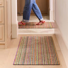Candy Bright Multi Washable Runner with a striped design, styled in a entryway.